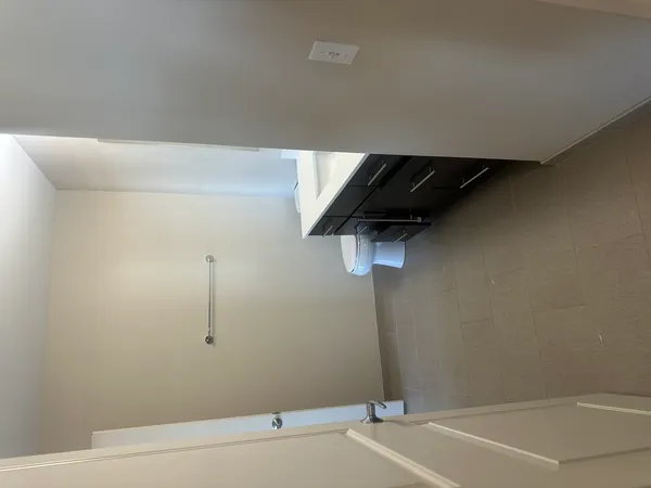 a view of a room with rack on the wall