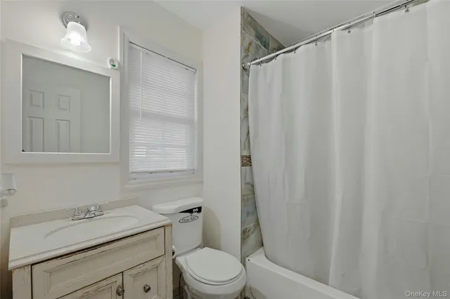 a view of a livingroom with furniture and staircase