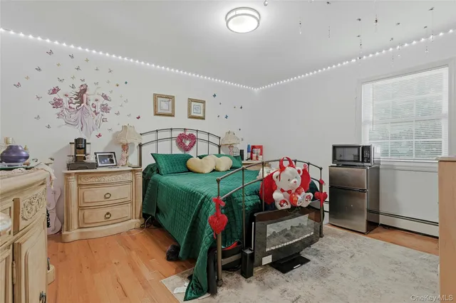 a bathroom with a sink toilet and a mirror
