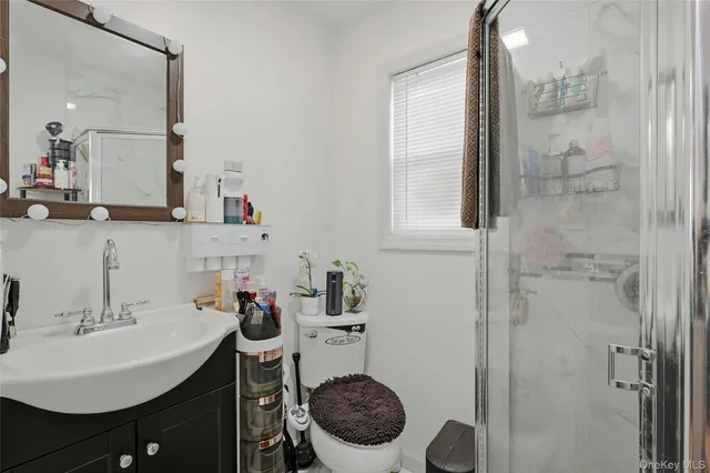 a bedroom with two beds and a chair