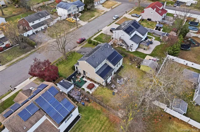 an aerial view of residential houses with outdoor space