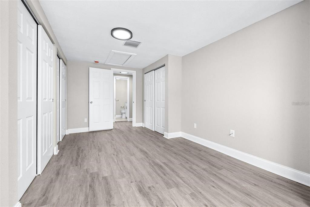 13926 Helen Avenue Hudson, FL 34667 - Photo 13 of 44 a view of an empty room with wooden floor