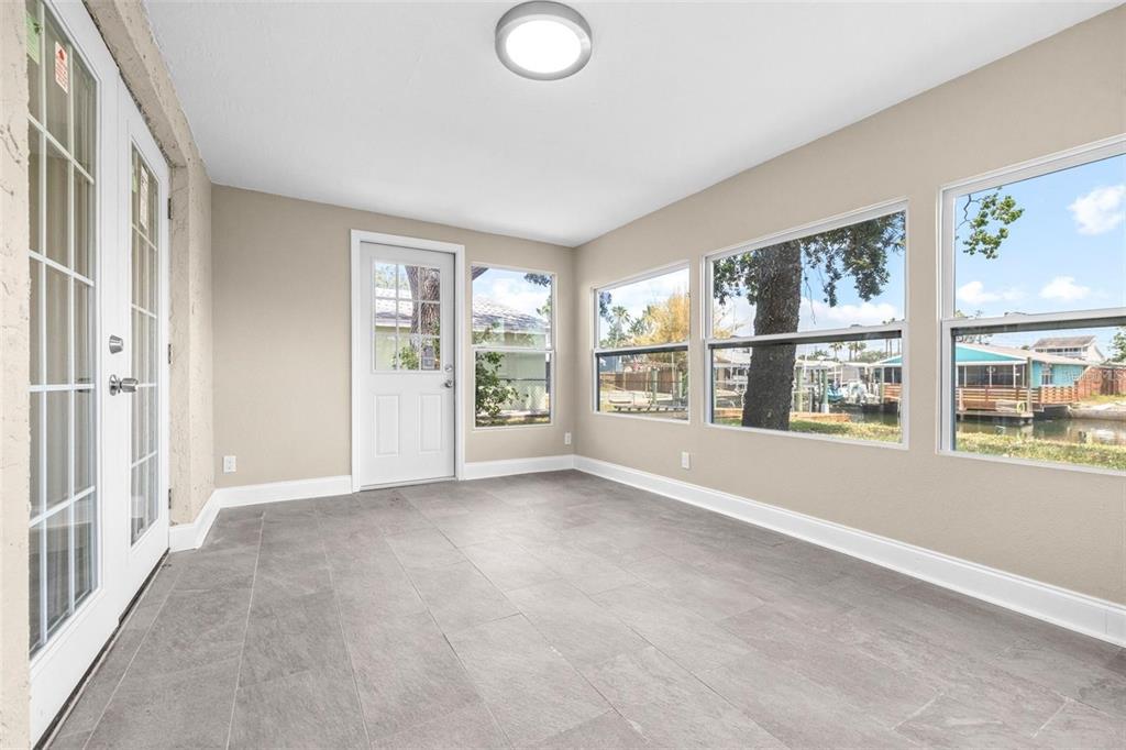 13926 Helen Avenue Hudson, FL 34667 - Photo 19 of 44 a view of an empty room with a window