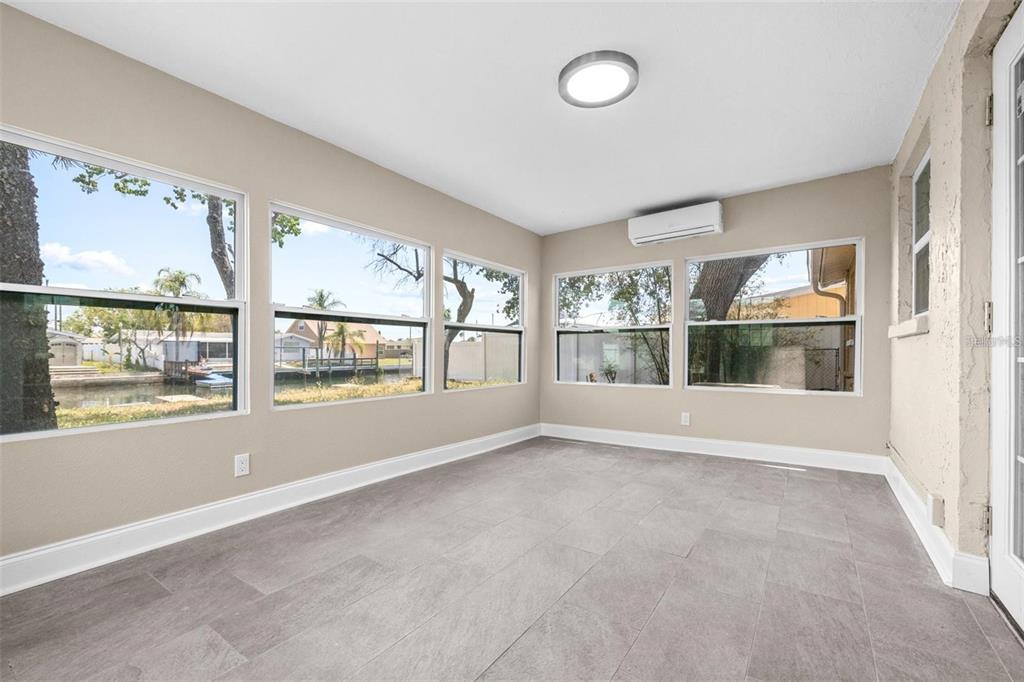 13926 Helen Avenue Hudson, FL 34667 - Photo 21 of 44 a view of an empty room with a window