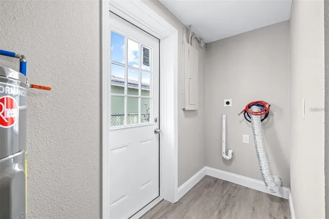 a view of an entryway with wooden floor
