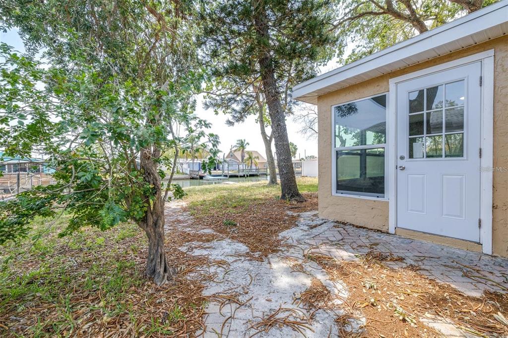 13926 Helen Avenue Hudson, FL 34667 - Photo 23 of 44 a view of a house with backyard and garden