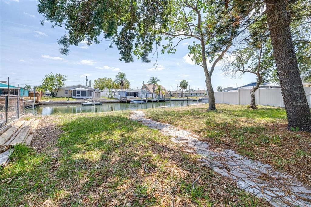 13926 Helen Avenue Hudson, FL 34667 - Photo 26 of 44 a view of a lake with houses in the back