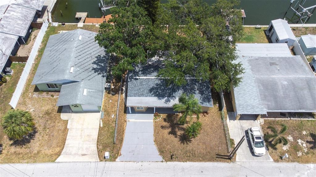 13926 Helen Avenue Hudson, FL 34667 - Photo 29 of 44 front view of a house with a tree