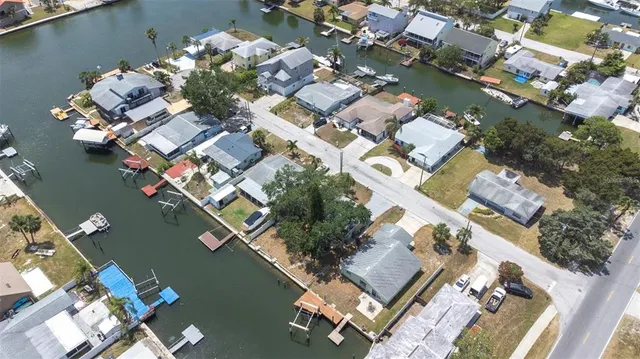 an aerial view of a house with a yard