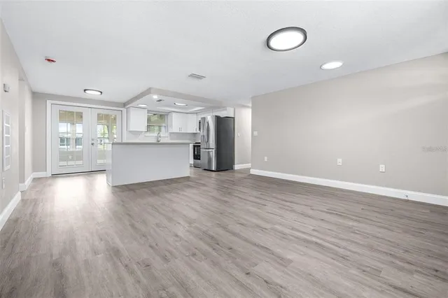 a view of kitchen and wooden floor