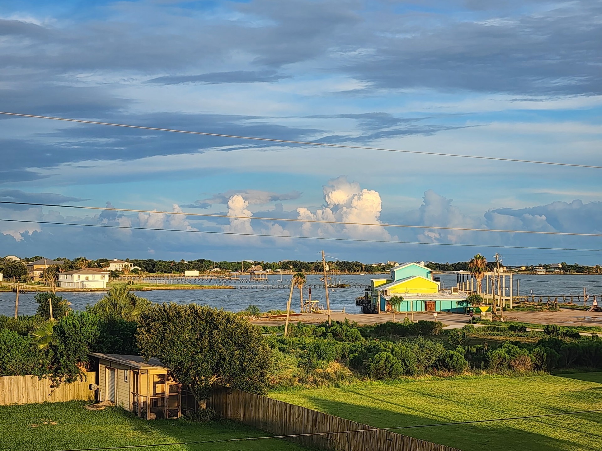 a view of a lake with a yard