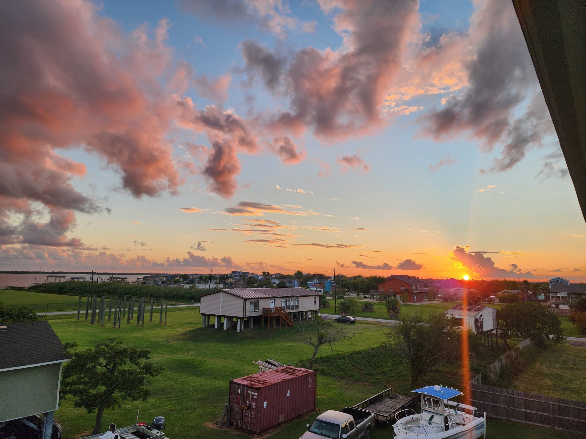 1026 20th Street Dickinson, TX 77539 - Photo 15 of 25 a view of a lake with a yard in front of it