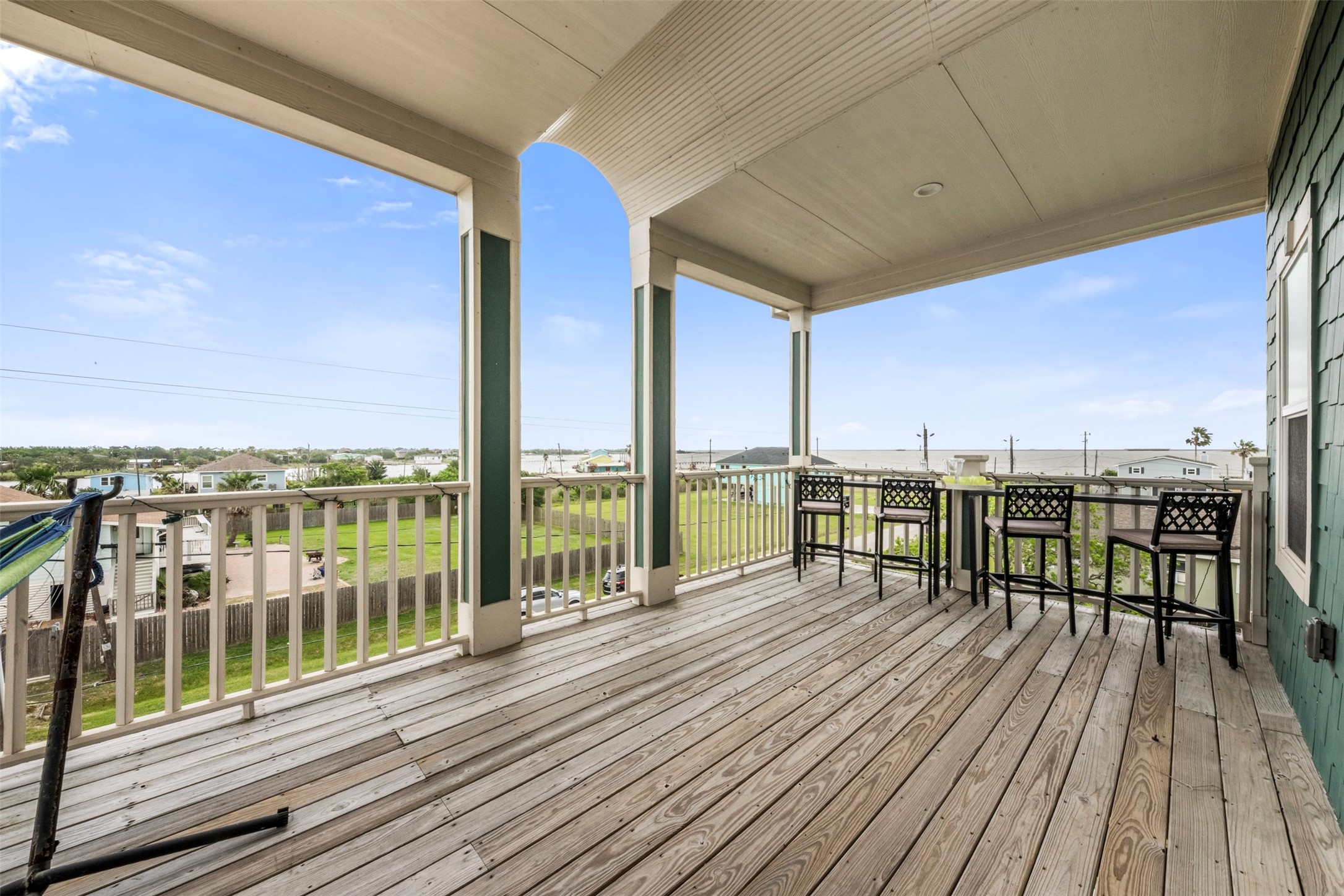 1026 20th Street Dickinson, TX 77539 - Photo 19 of 25 The vast outdoor patio invites you to slow down. Picture yourself swining in the hammock behind this shot, catching the breeze, and letting the stress of the week fade away.