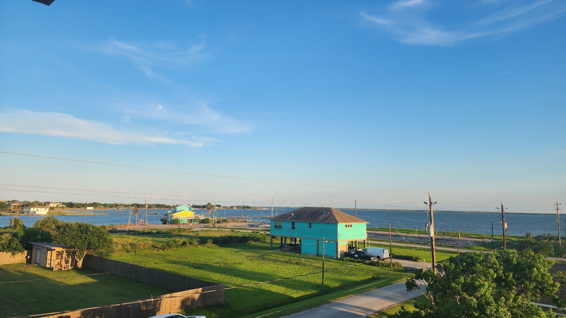 1026 20th Street Dickinson, TX 77539 - Photo 21 of 25 Breathtaking, unobstructed bay views take center stage. Enjoy water views from this private, breezy balcony. It’s the ultimate spot to unwind, take in the scenery, and feel the coastal wind, you’ll never want to leave.