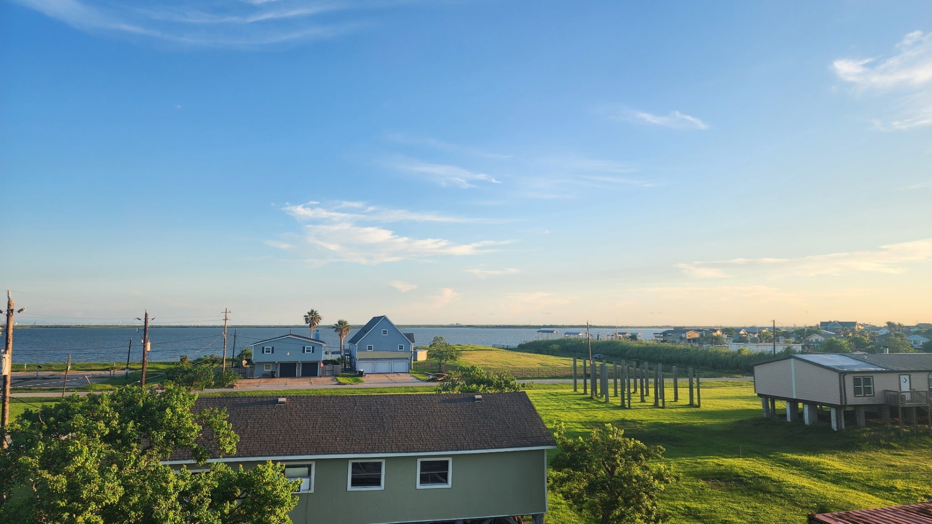 1026 20th Street Dickinson, TX 77539 - Photo 24 of 25 a view of a lake with a building in the background