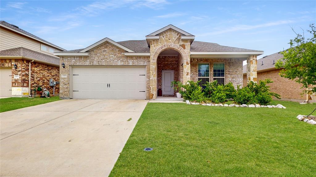 4005 Glastonbury Road McKinney, TX 75071 - Photo 1 of 39 a front view of a house with a yard and garage