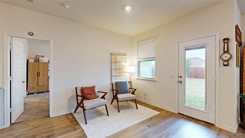 4005 Glastonbury Road McKinney, TX 75071 - Photo 12 of 39 a living room with furniture and a wooden floor