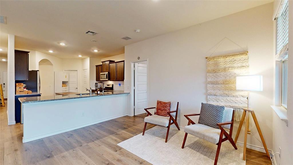 4005 Glastonbury Road McKinney, TX 75071 - Photo 13 of 39 a kitchen with a table and chairs in it