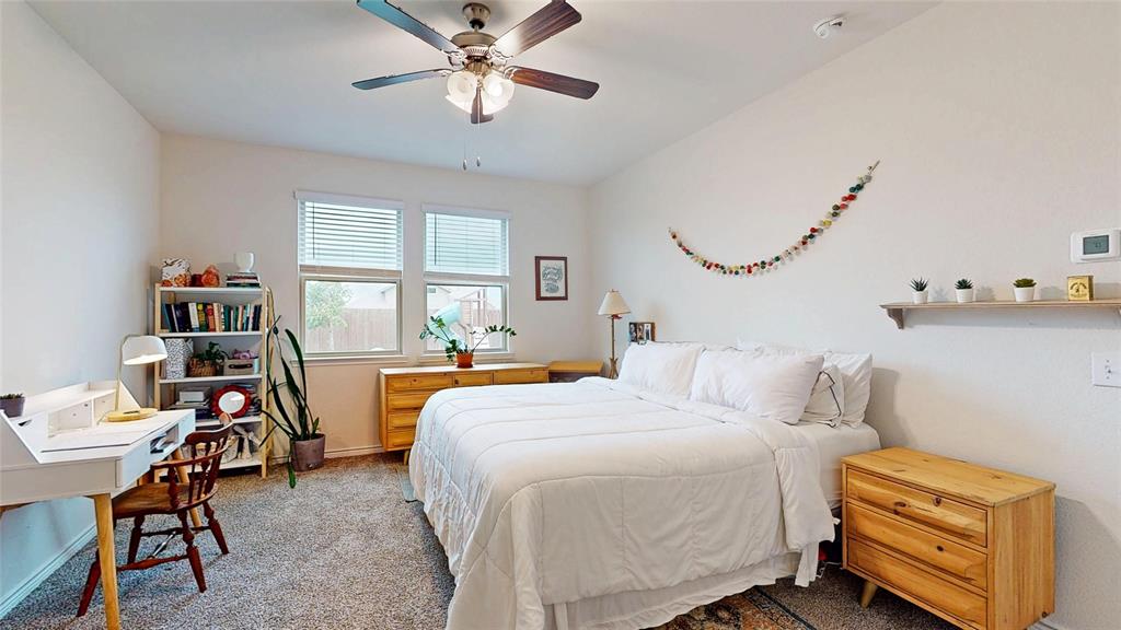 4005 Glastonbury Road McKinney, TX 75071 - Photo 17 of 39 a bedroom with a bed and a bookshelf