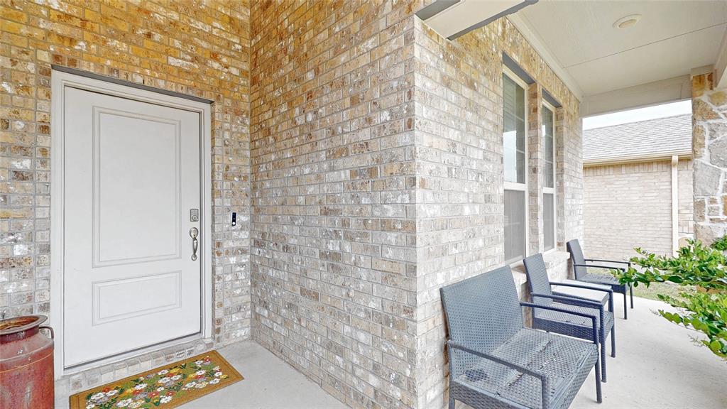 4005 Glastonbury Road McKinney, TX 75071 - Photo 2 of 39 a view of balcony with chair and potted plant