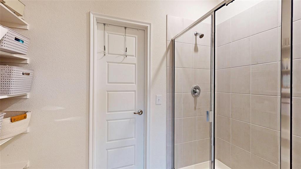 4005 Glastonbury Road McKinney, TX 75071 - Photo 22 of 39 a bathroom with a shower
