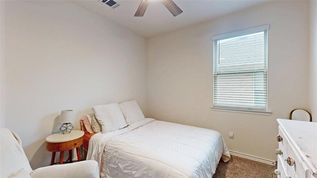 4005 Glastonbury Road McKinney, TX 75071 - Photo 23 of 39 a bedroom with a bed and a window