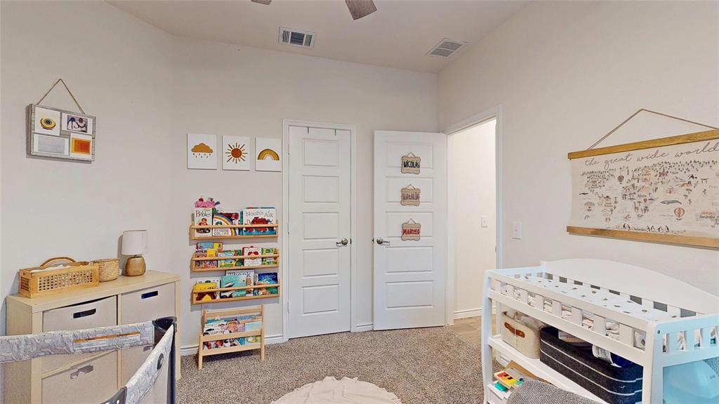 4005 Glastonbury Road McKinney, TX 75071 - Photo 27 of 39 a bedroom with a bed and a window