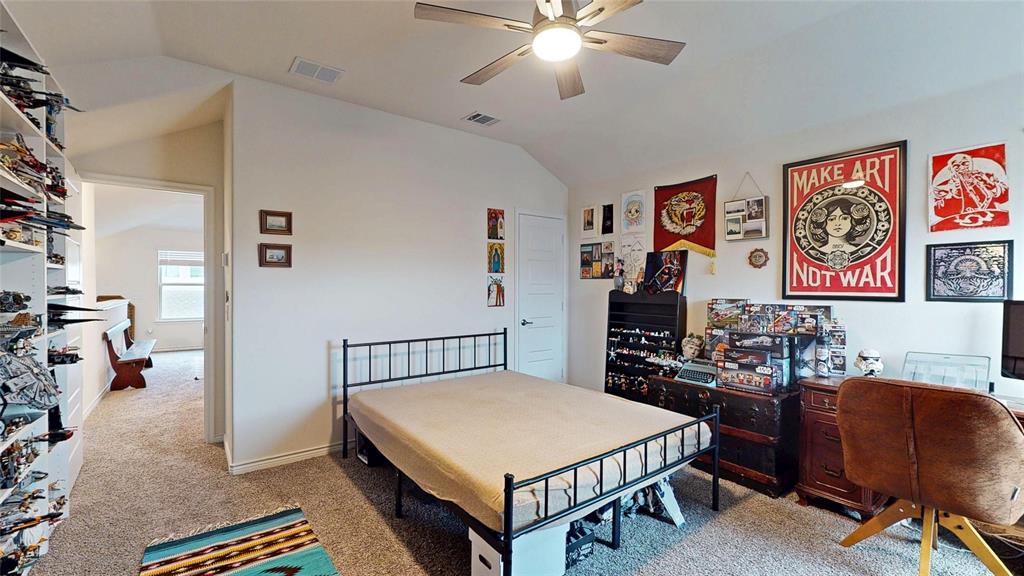 4005 Glastonbury Road McKinney, TX 75071 - Photo 36 of 39 a bedroom with a bed and furniture
