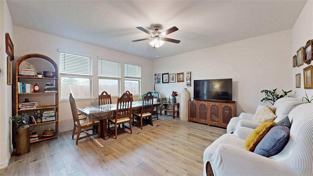 4005 Glastonbury Road McKinney, TX 75071 - Photo 5 of 39 a view of a livingroom with furniture and a flat screen tv