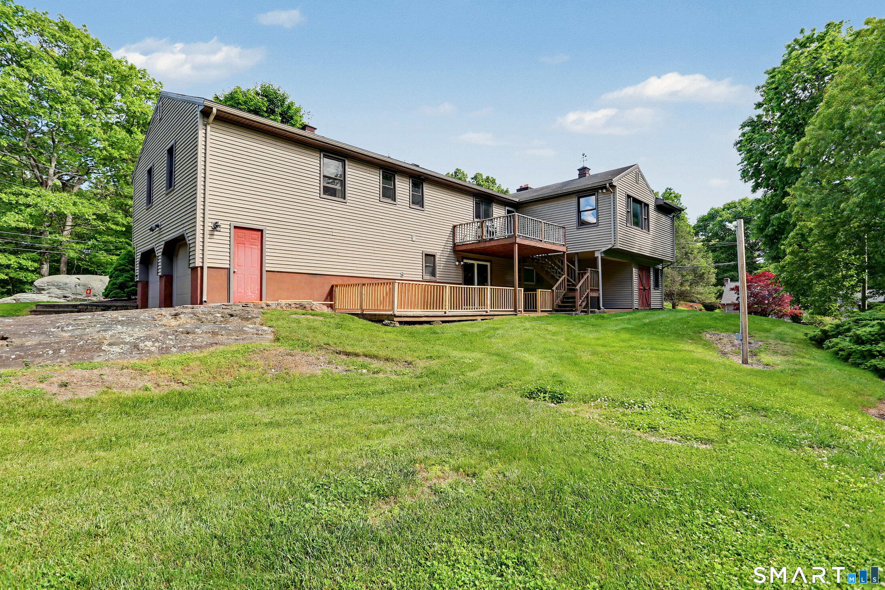 632 Wheelers Farm Road Orange, CT 06477 - Photo 36 of 39 a view of a house with a big yard and large tree