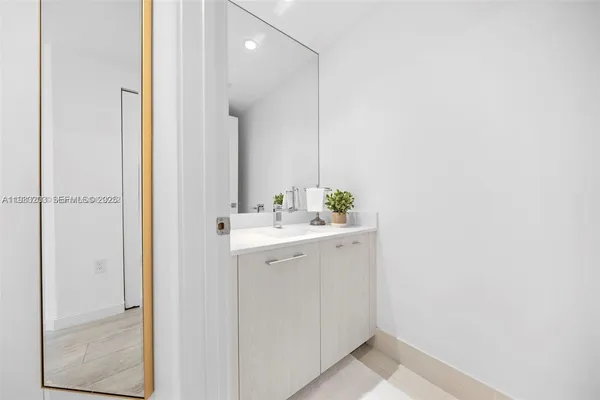 a bathroom with a sink and a mirror
