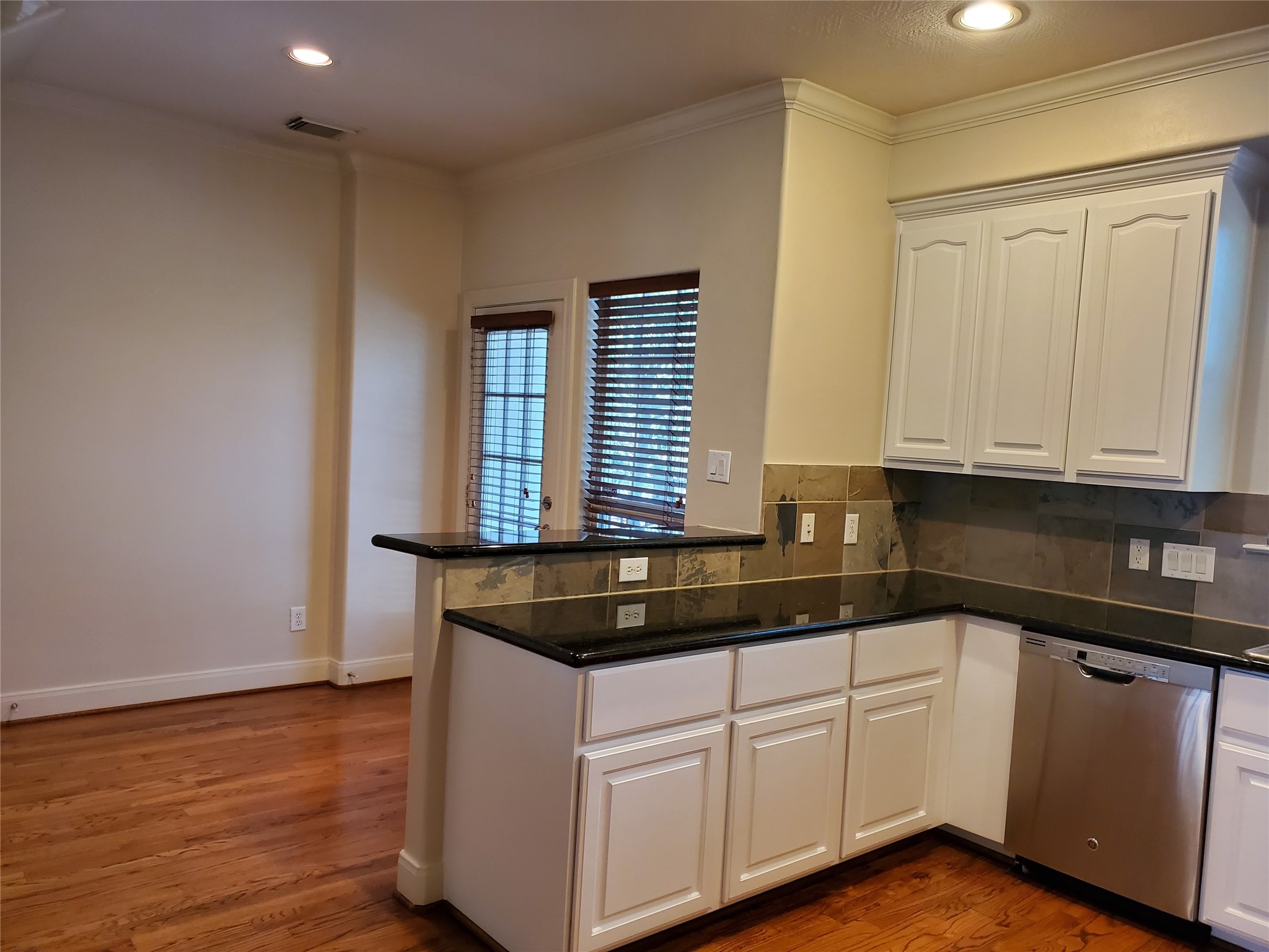 326 Malone Street Houston, TX 77007 - Photo 12 of 25 a kitchen with granite countertop white cabinets and a sink