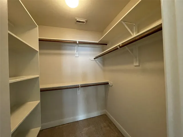 a large bathroom with a large tub shower and sink