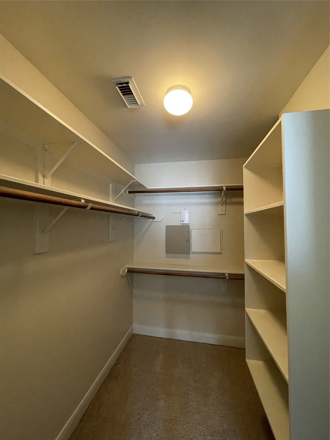 326 Malone Street Houston, TX 77007 - Photo 22 of 25 a view of walk in closet with empty racks