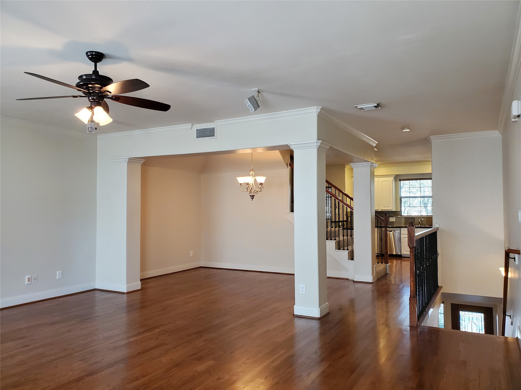 326 Malone Street Houston, TX 77007 - Photo 8 of 25 a view of a livingroom with wooden floor and a ceiling fan
