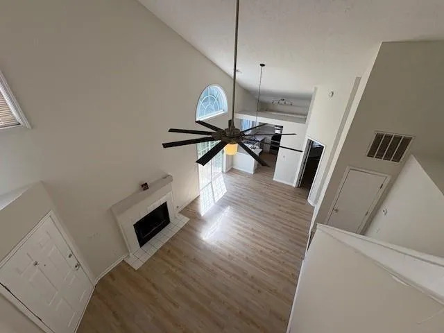 a view of living room with furniture and wooden floor