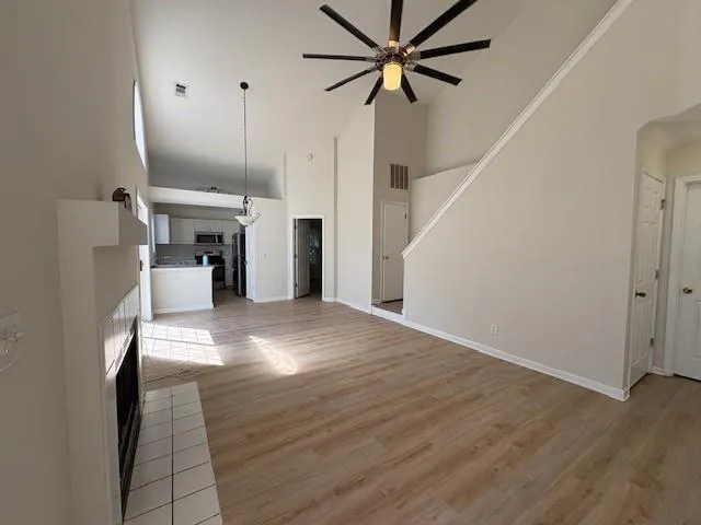 a view of a living room with a fireplace