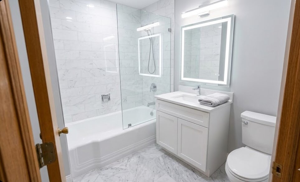 6933 South Honore Street Chicago, IL 60636 - Photo 14 of 18 a bathroom with a granite countertop sink a toilet and shower