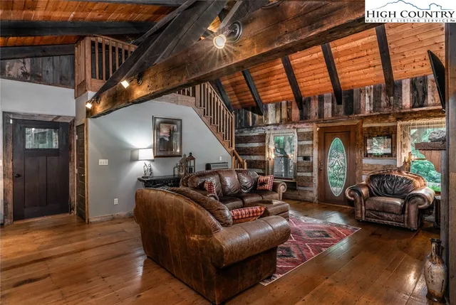 a living room with furniture or window and a wooden floor