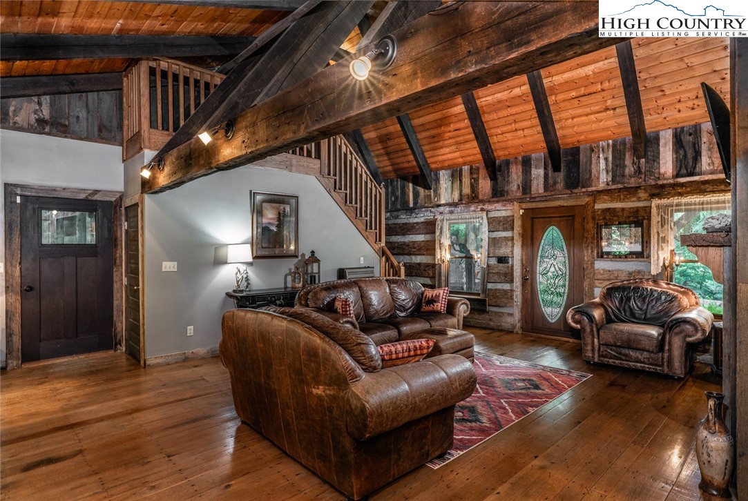 164 Avery Co High School Road Newland, NC 28657 - Photo 11 of 50 a living room with furniture or window and a wooden floor