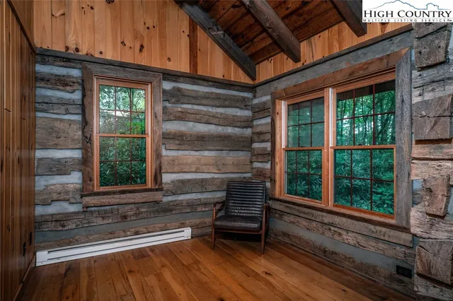 a front view of a house with entryway and wooden floor