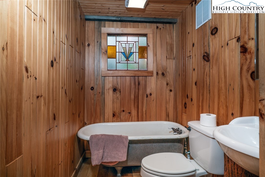 164 Avery Co High School Road Newland, NC 28657 - Photo 36 of 50 a bathroom with a sink toilet and shower