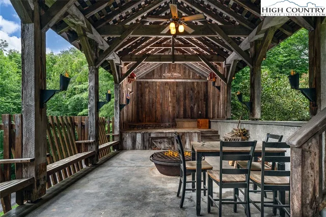 a view of a chairs and table in the patio
