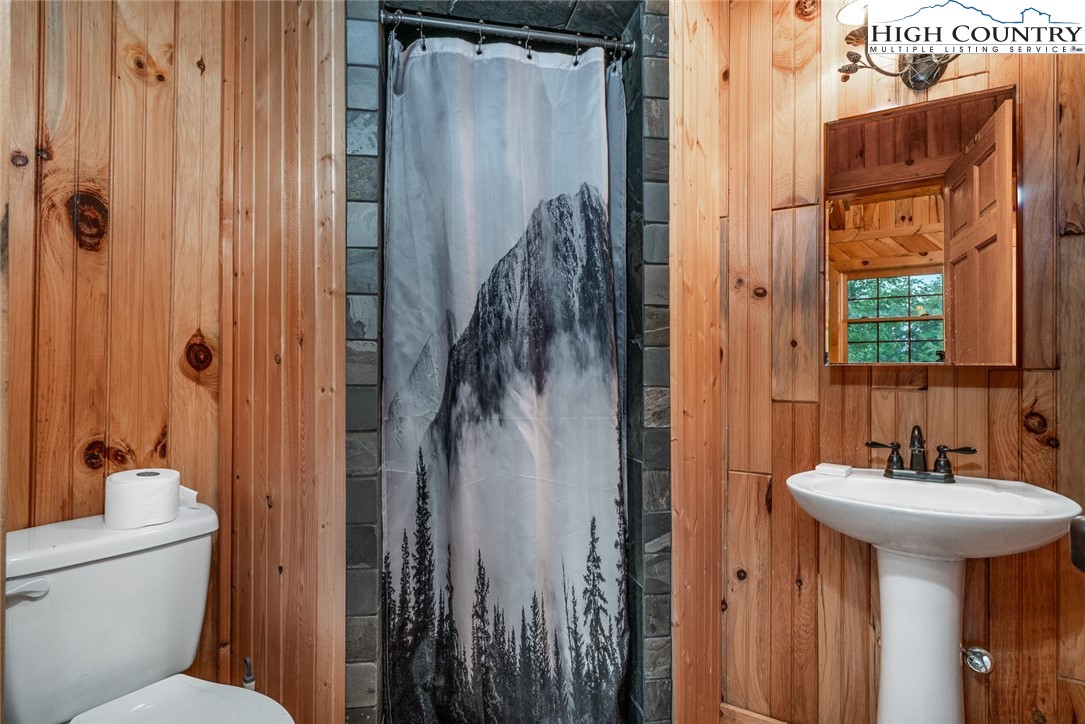 164 Avery Co High School Road Newland, NC 28657 - Photo 41 of 50 a bathroom with a sink a toilet and shower