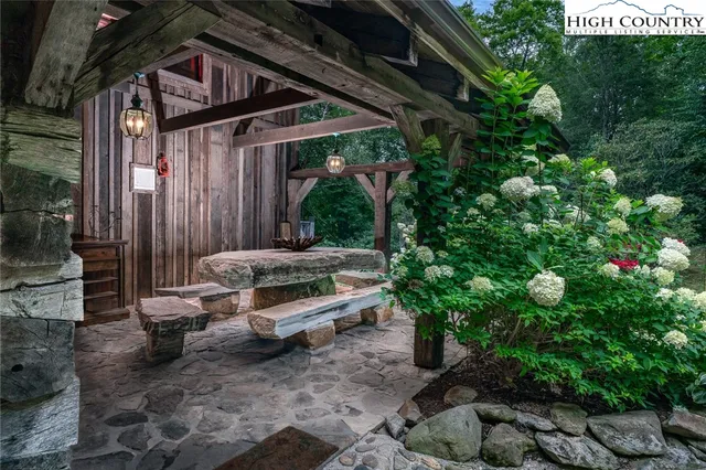 a backyard of a house with outdoor seating