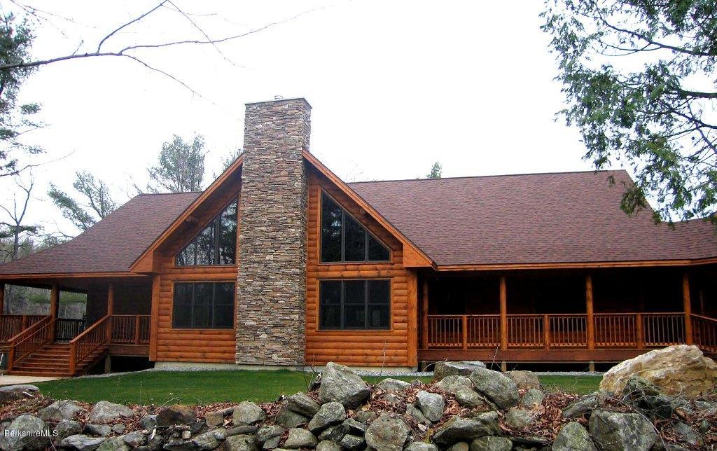 7 Sunset Court Otis, MA 01253 - Photo 11 of 21 a front view of a house with a garden