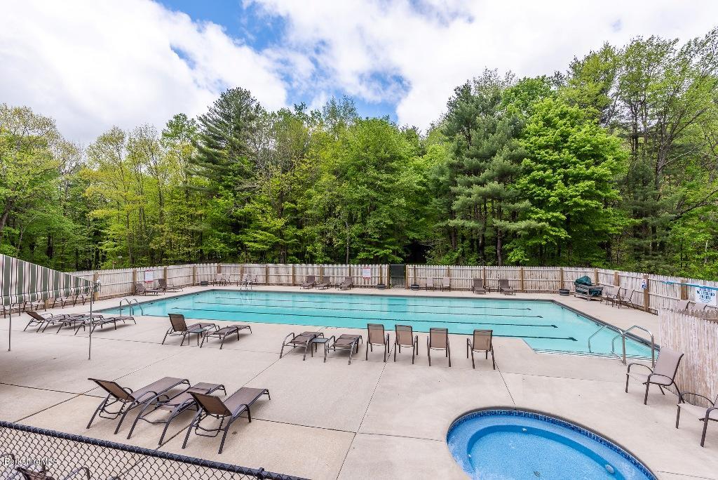 7 Sunset Court Otis, MA 01253 - Photo 17 of 21 a view of a swimming pool with a patio