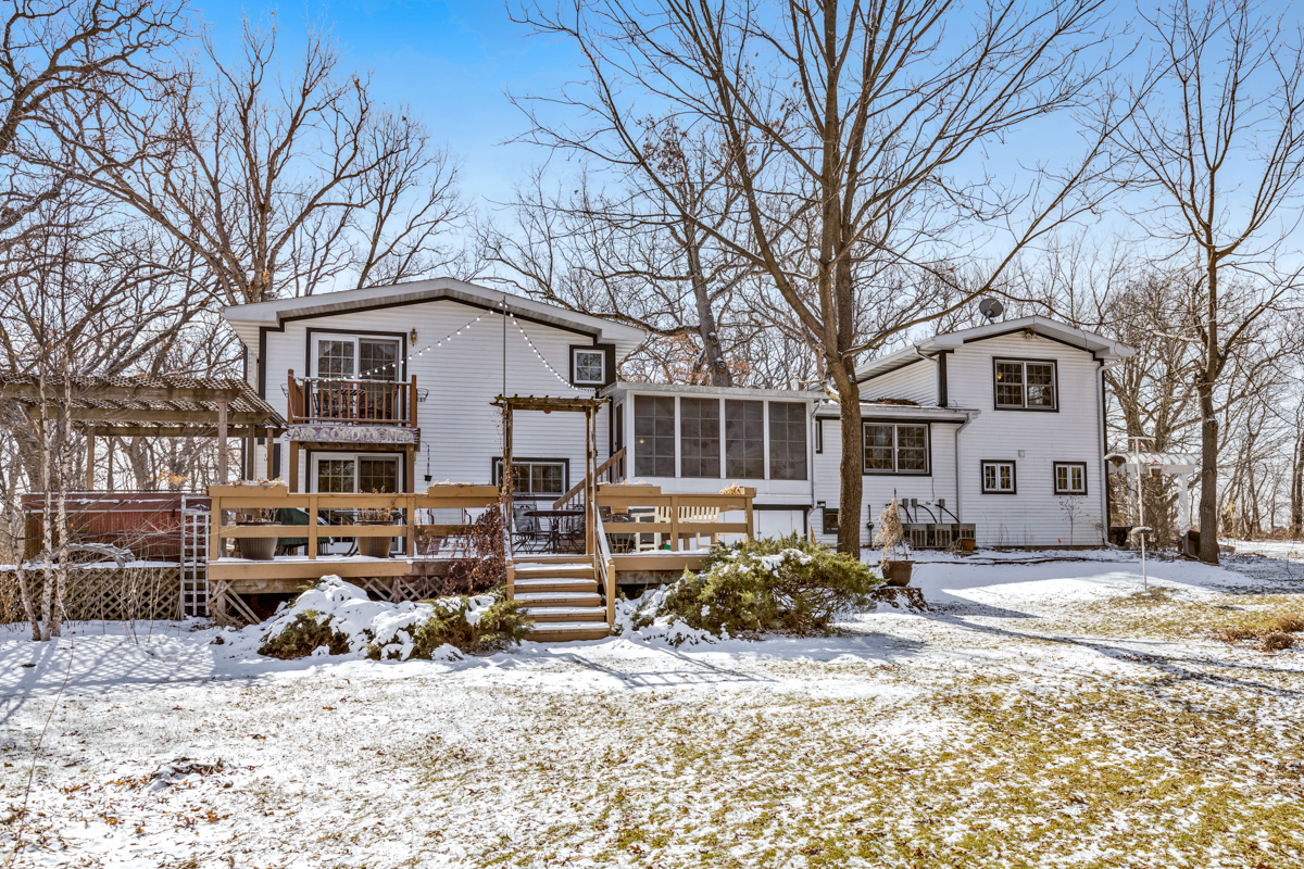 22516 Carmack Road Marengo, IL 60152 - Photo 30 of 40 a front view of a house with a yard covered in snow