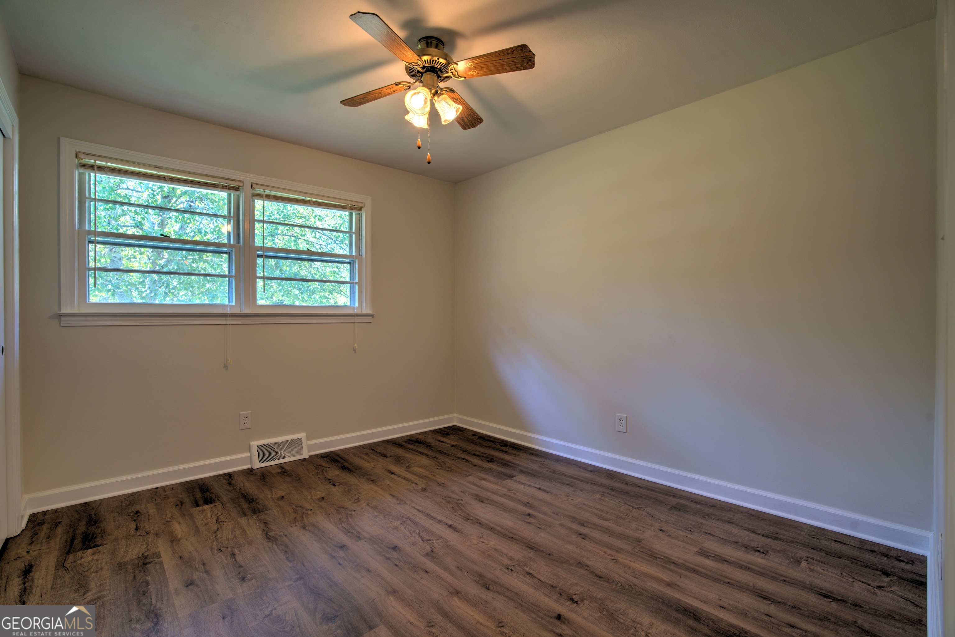 25 Ridge Drive Southwest Rome, GA 30165 - Photo 11 of 37 an empty room with wooden floor and windows