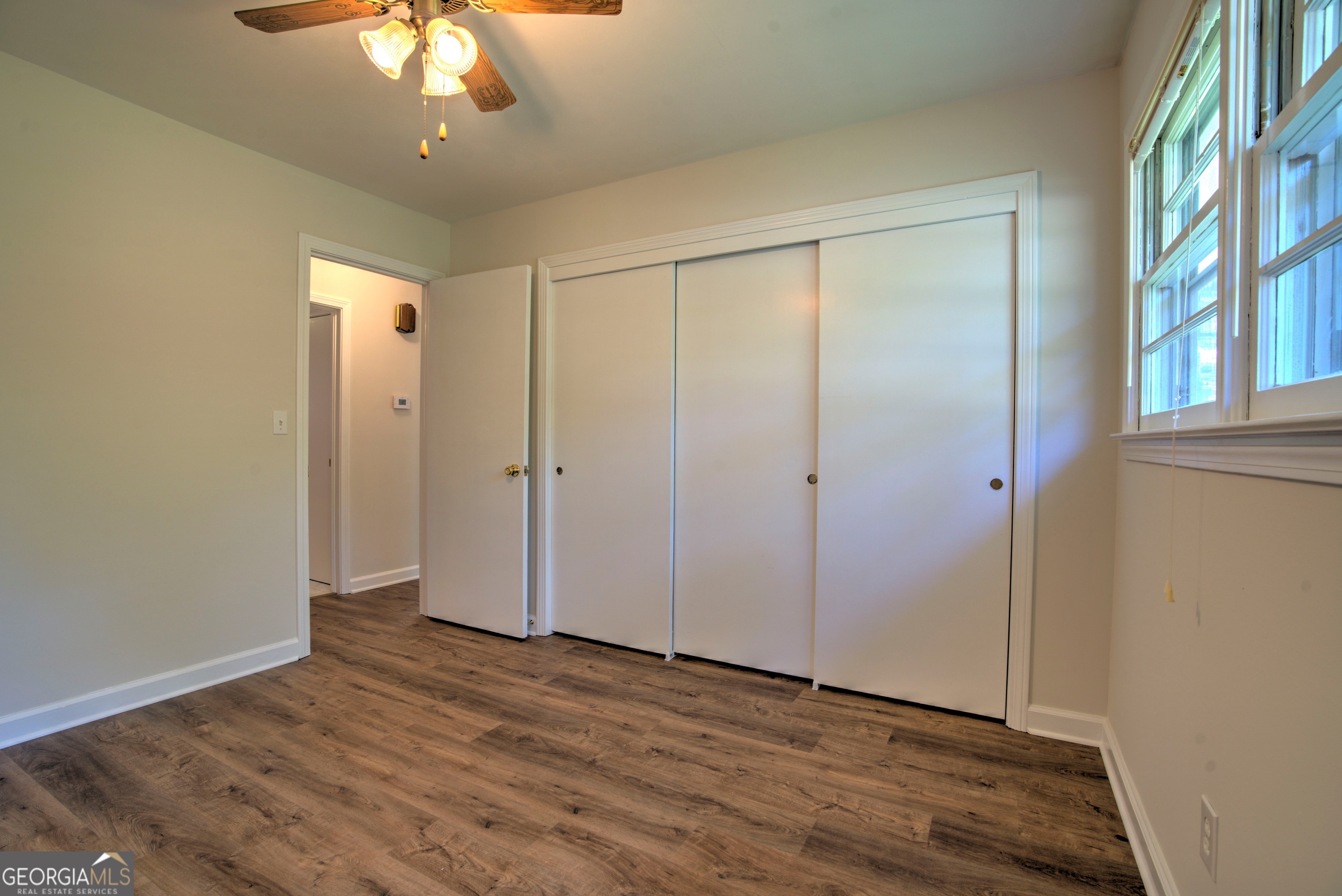 25 Ridge Drive Southwest Rome, GA 30165 - Photo 12 of 37 wooden floor in an empty room with a window